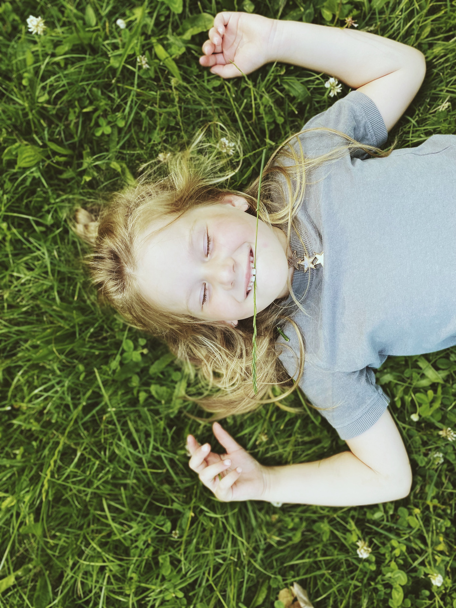 Kid Lying on Grass